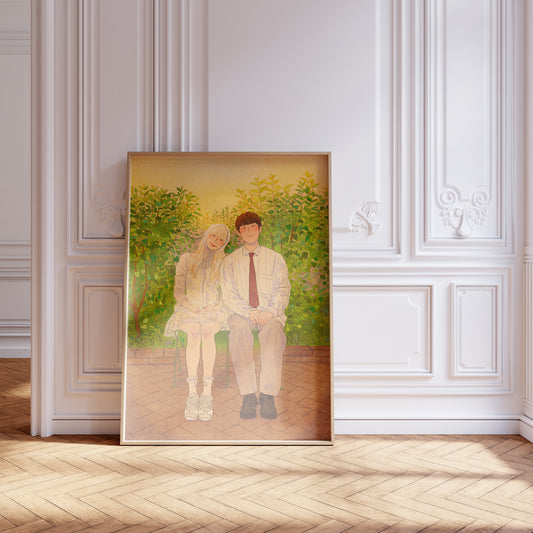 Framed artwork of two people sitting together on a wall with decorative molding.